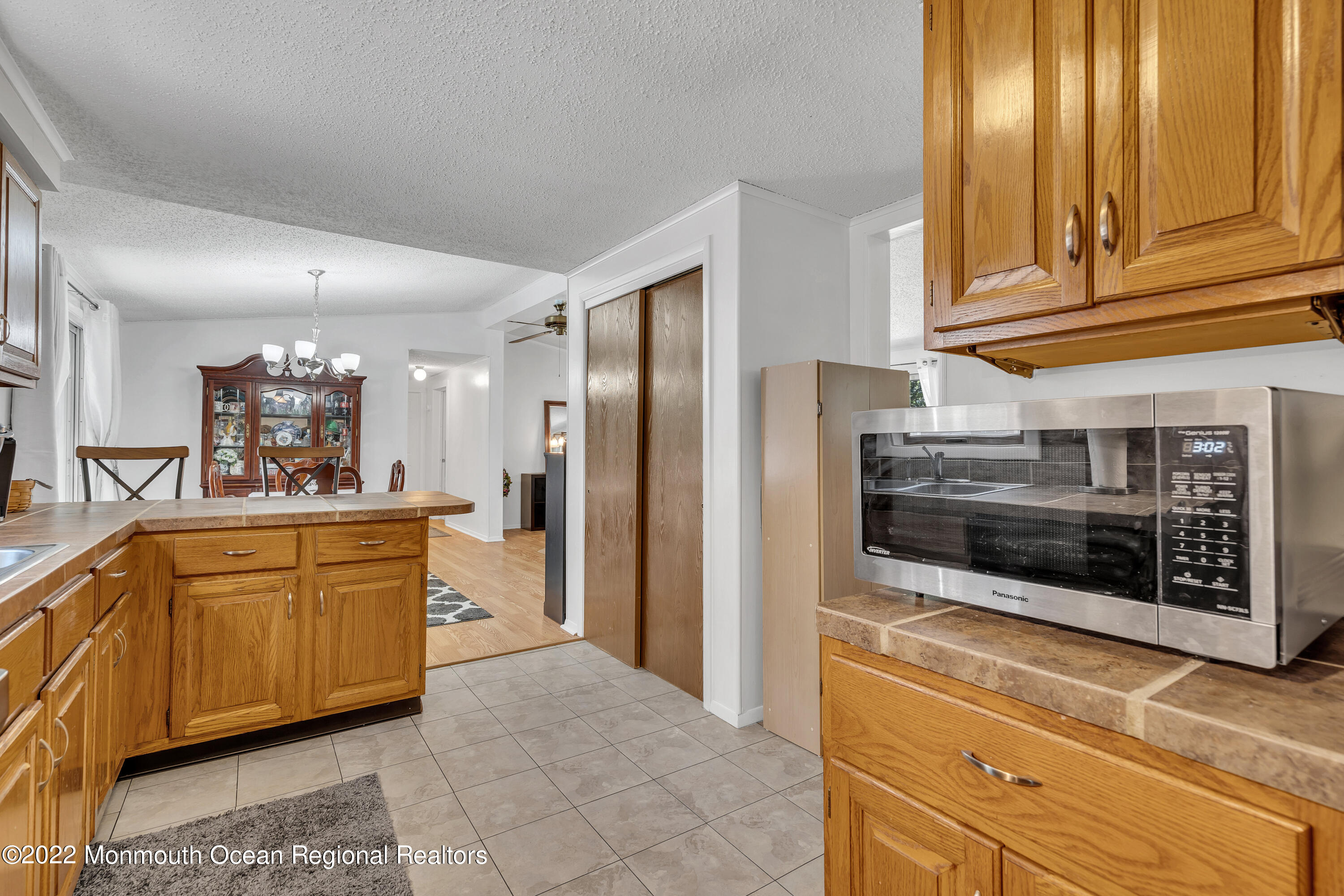 356 Cedar Swamp Road Jackson, NJ 08527 - Photo 19 of 56 a large kitchen with stainless steel appliances granite countertop a refrigerator and a stove top oven