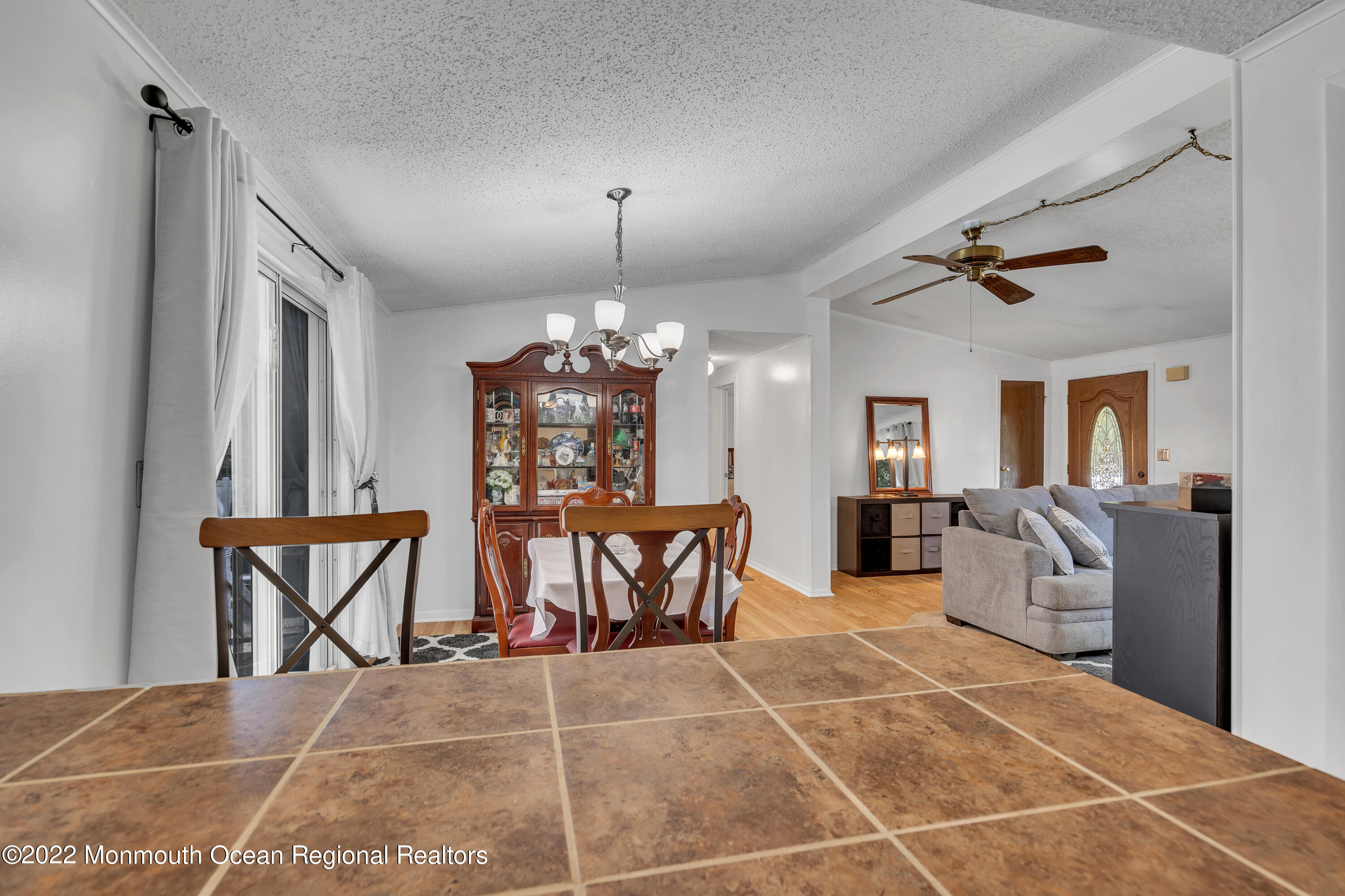 356 Cedar Swamp Road Jackson, NJ 08527 - Photo 21 of 56 a view of an dining room with furniture and chandelier