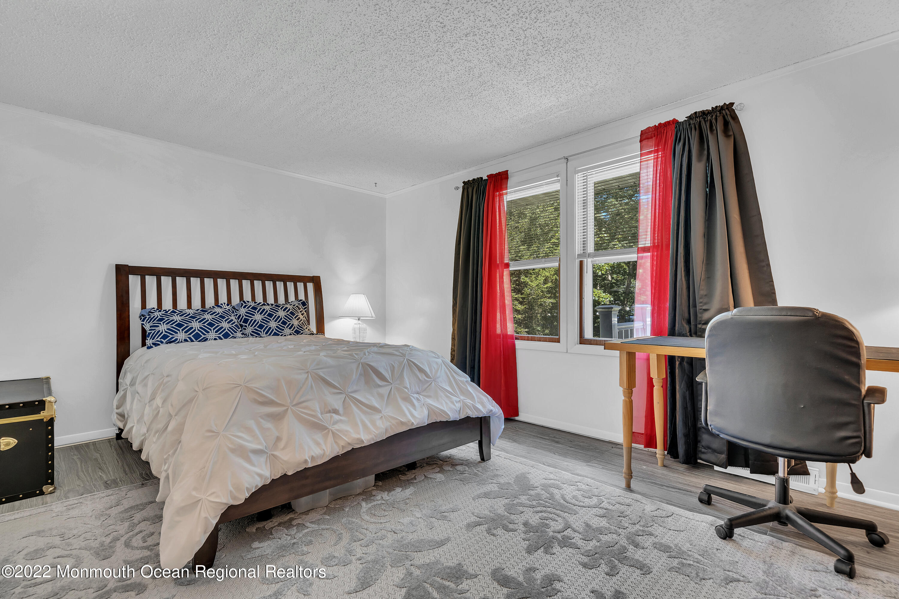 356 Cedar Swamp Road Jackson, NJ 08527 - Photo 23 of 56 a bedroom with a bed and a chair