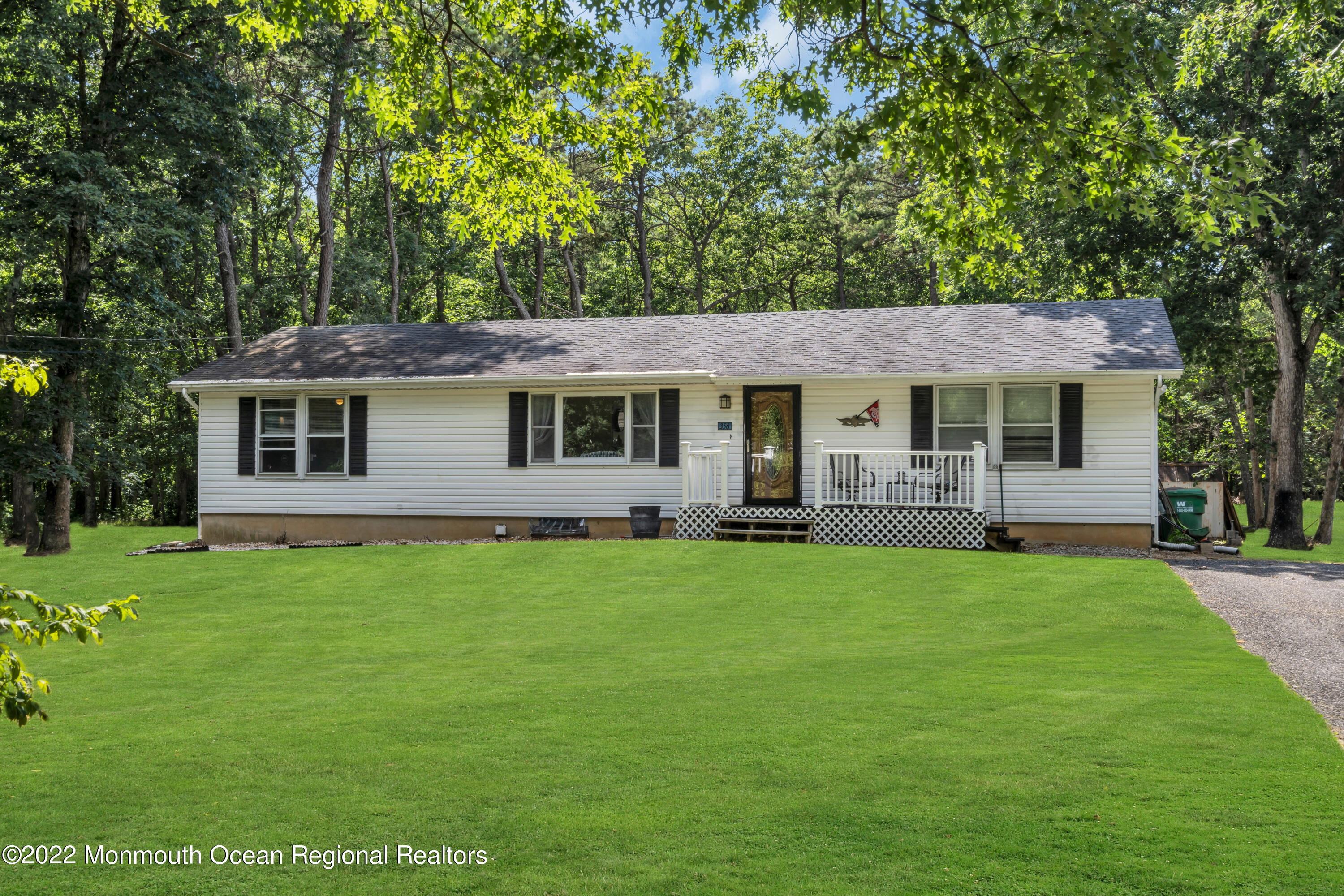 356 Cedar Swamp Road Jackson, NJ 08527 - Photo 38 of 56 a front view of a house with a garden