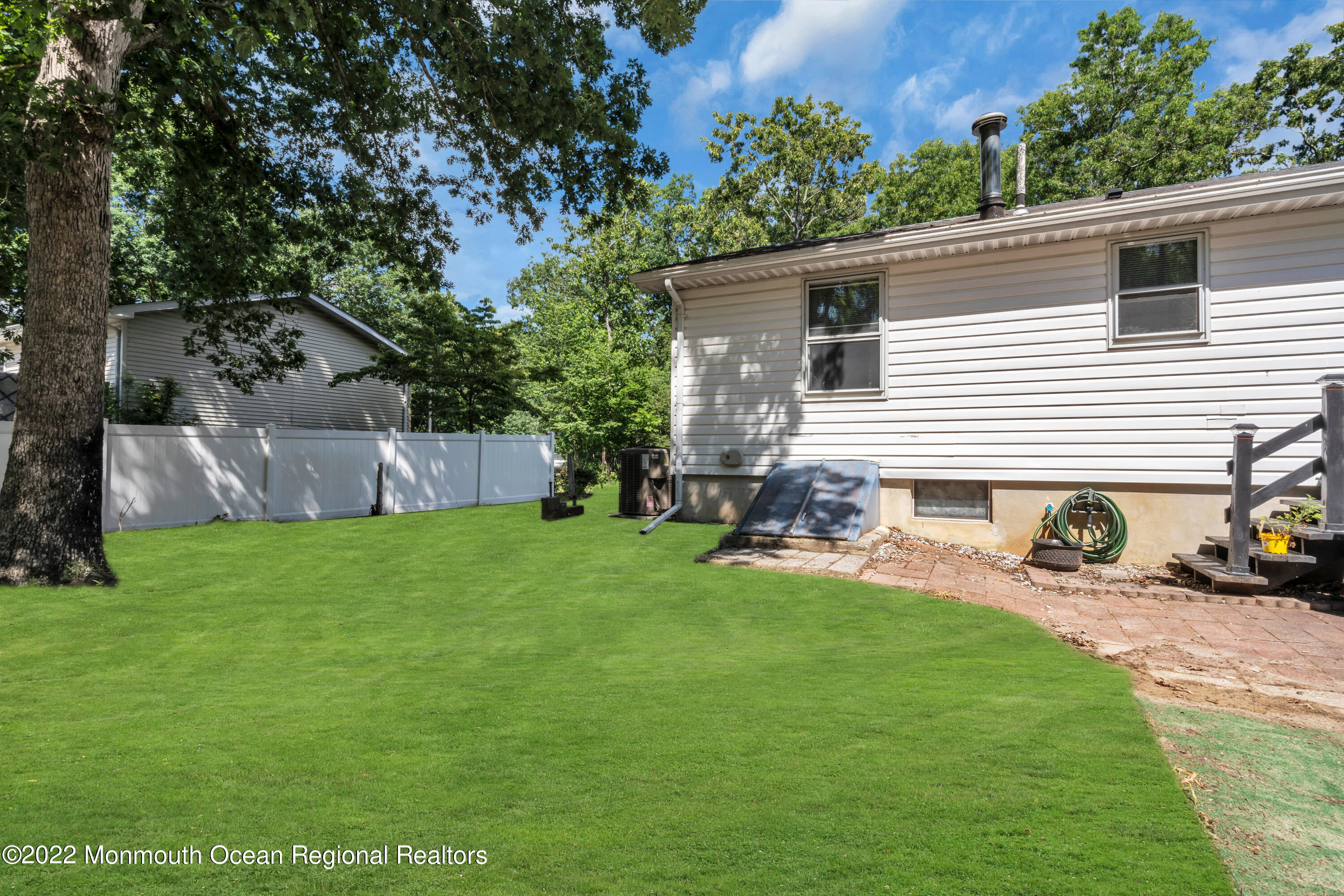 356 Cedar Swamp Road Jackson, NJ 08527 - Photo 46 of 56 a view of a house with backyard and sitting area
