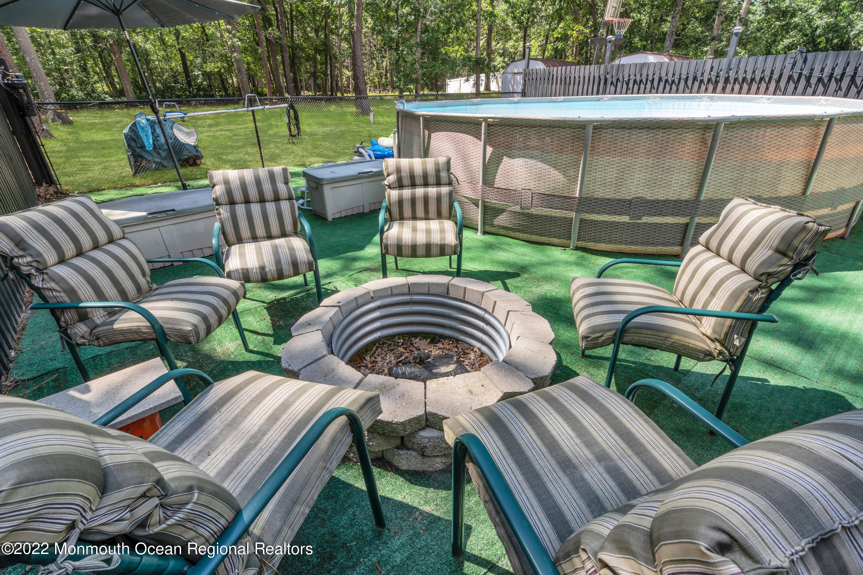 356 Cedar Swamp Road Jackson, NJ 08527 - Photo 51 of 56 a view of a patio with couches chairs and a yard