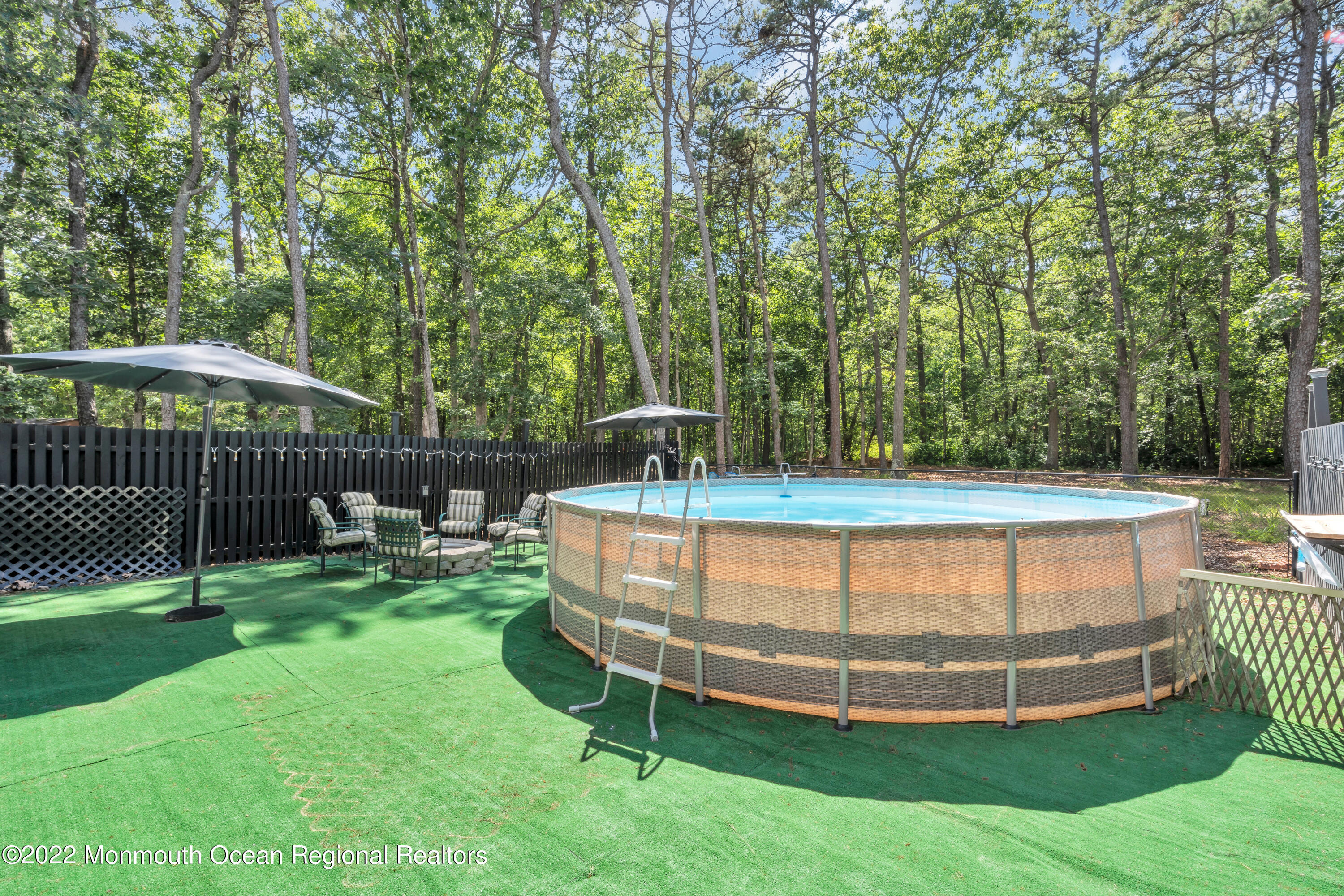 356 Cedar Swamp Road Jackson, NJ 08527 - Photo 54 of 56 a view of a wooden chairs and backyard