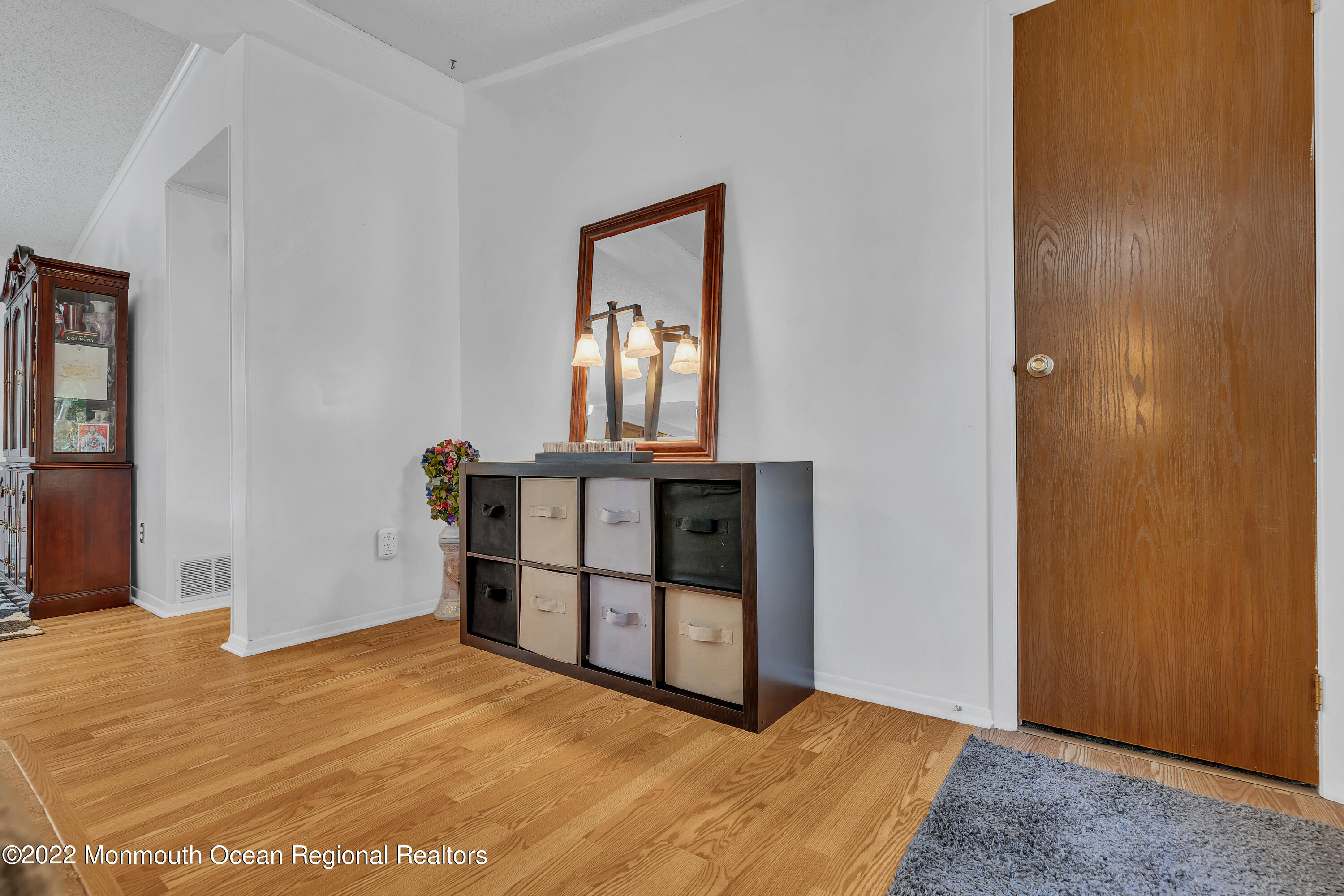 356 Cedar Swamp Road Jackson, NJ 08527 - Photo 6 of 56 a view of a room that has a bed and mirror in it