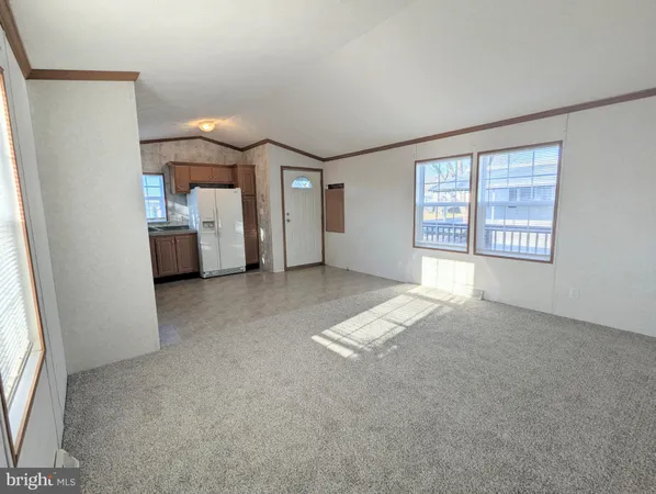 a view of livingroom with furniture and window