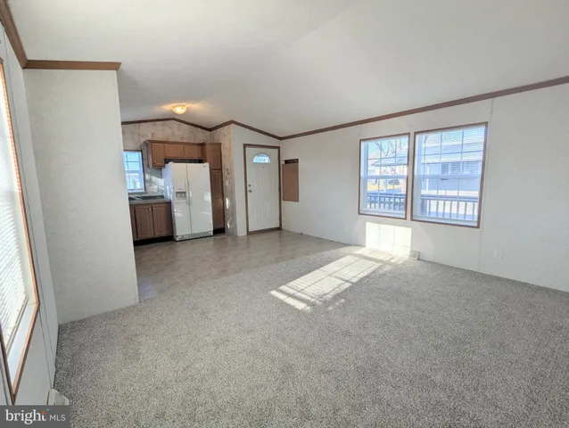 a view of livingroom with furniture and window