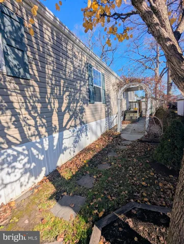 a backyard of a house with large trees