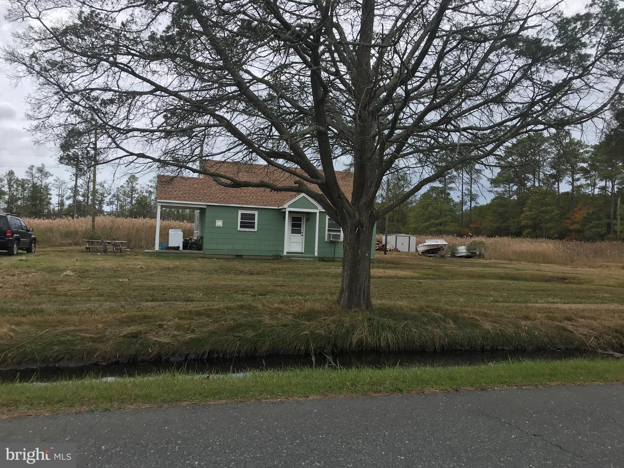 a view of house with backyard