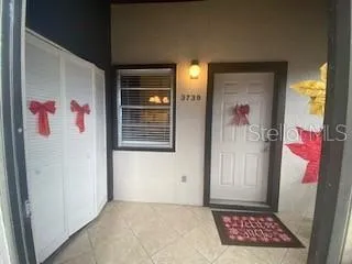 a bedroom with a bed and a ceiling fan