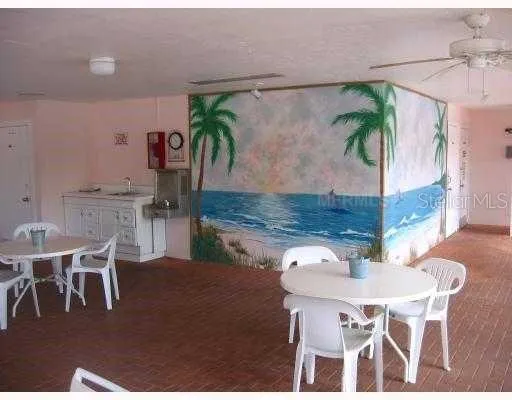 a dining room with furniture and a window