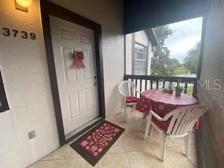 a view of a balcony with furniture