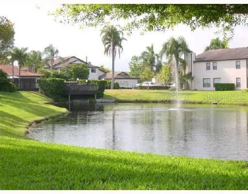 a view of a lake with a garden