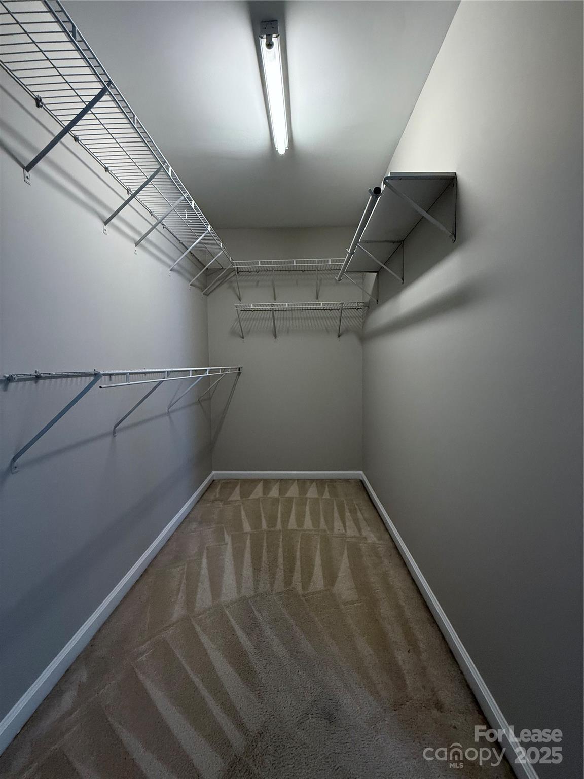 4968 Prosperity Ridge Road Charlotte, NC 28269 - Photo 11 of 19 a view of a room with racks on the wall