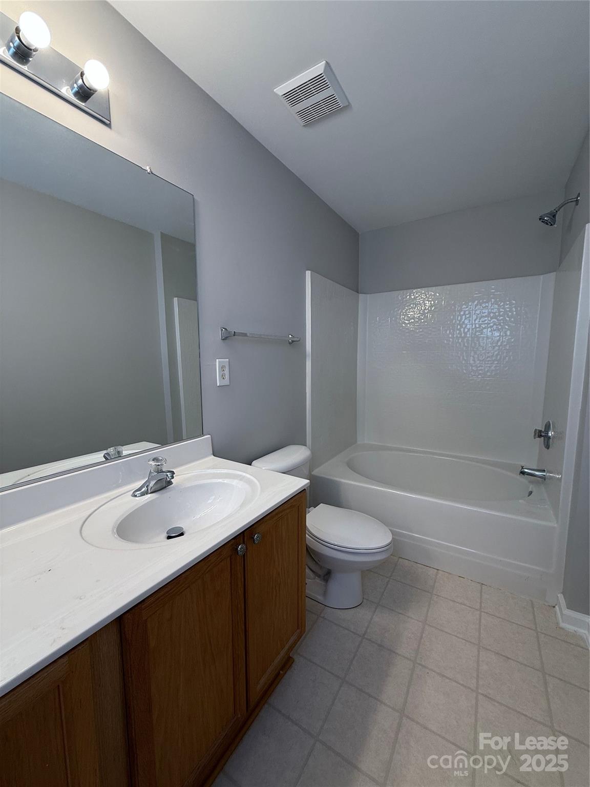 4968 Prosperity Ridge Road Charlotte, NC 28269 - Photo 9 of 19 a bathroom with a sink a toilet and shower