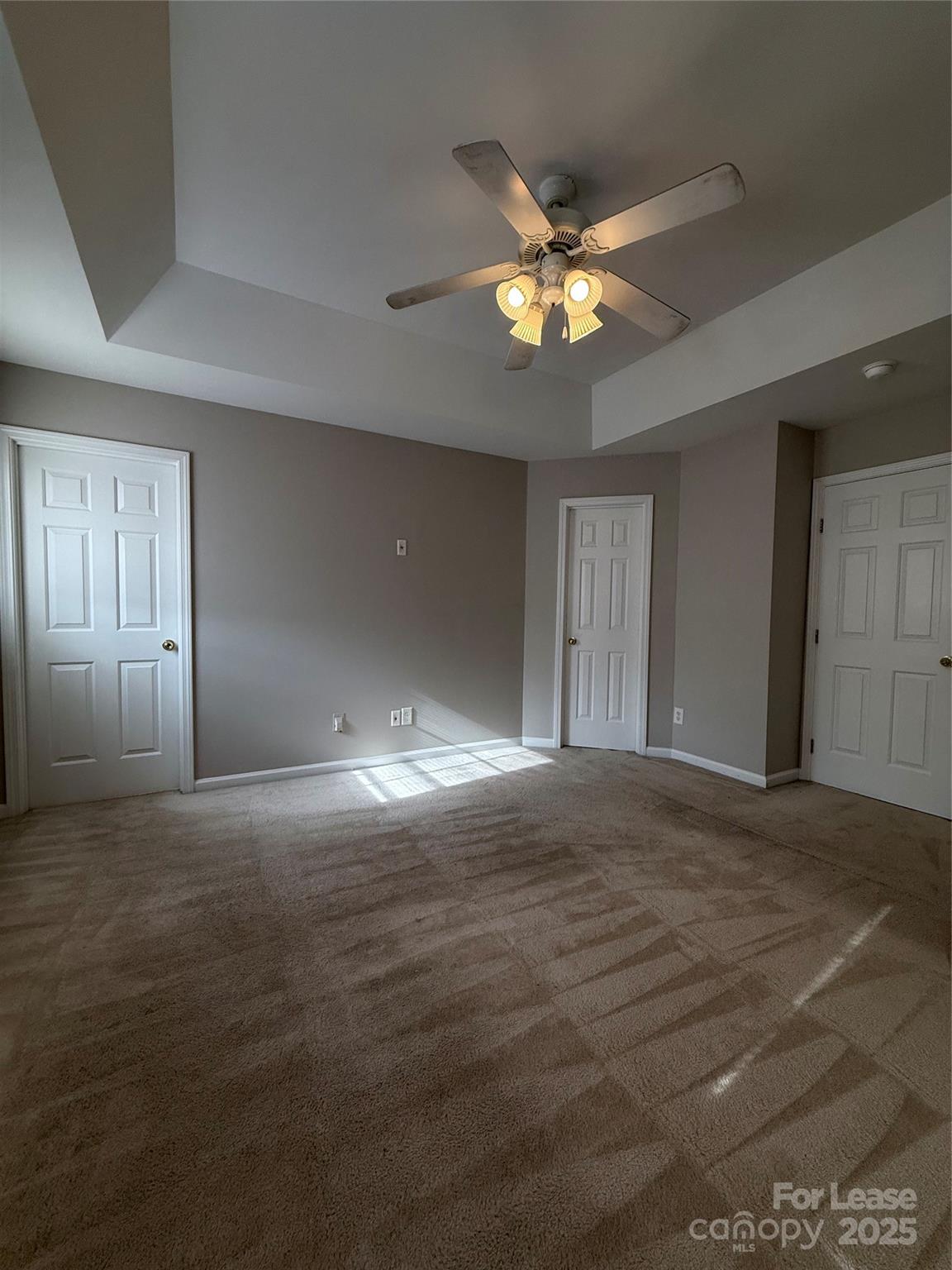 4968 Prosperity Ridge Road Charlotte, NC 28269 - Photo 10 of 19 a view of an empty room with a chandelier fan