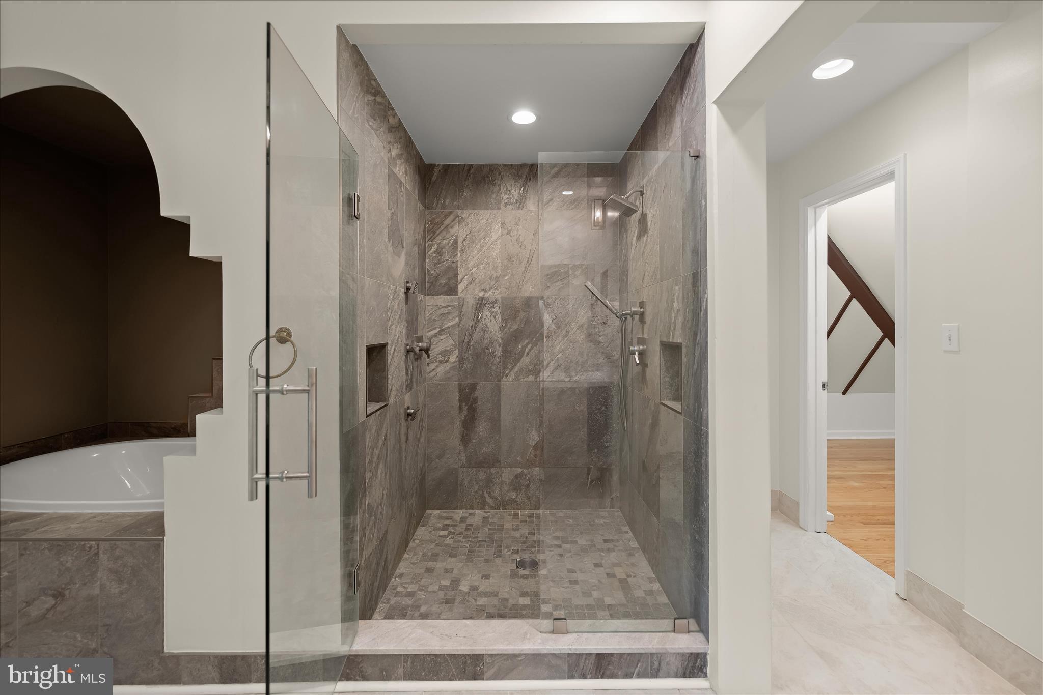 5104 Scarsdale Road Bethesda, MD 20816 - Photo 39 of 68 a bathroom with a glass shower door