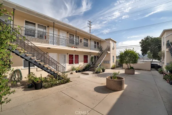 a view of a house with couches in the patio