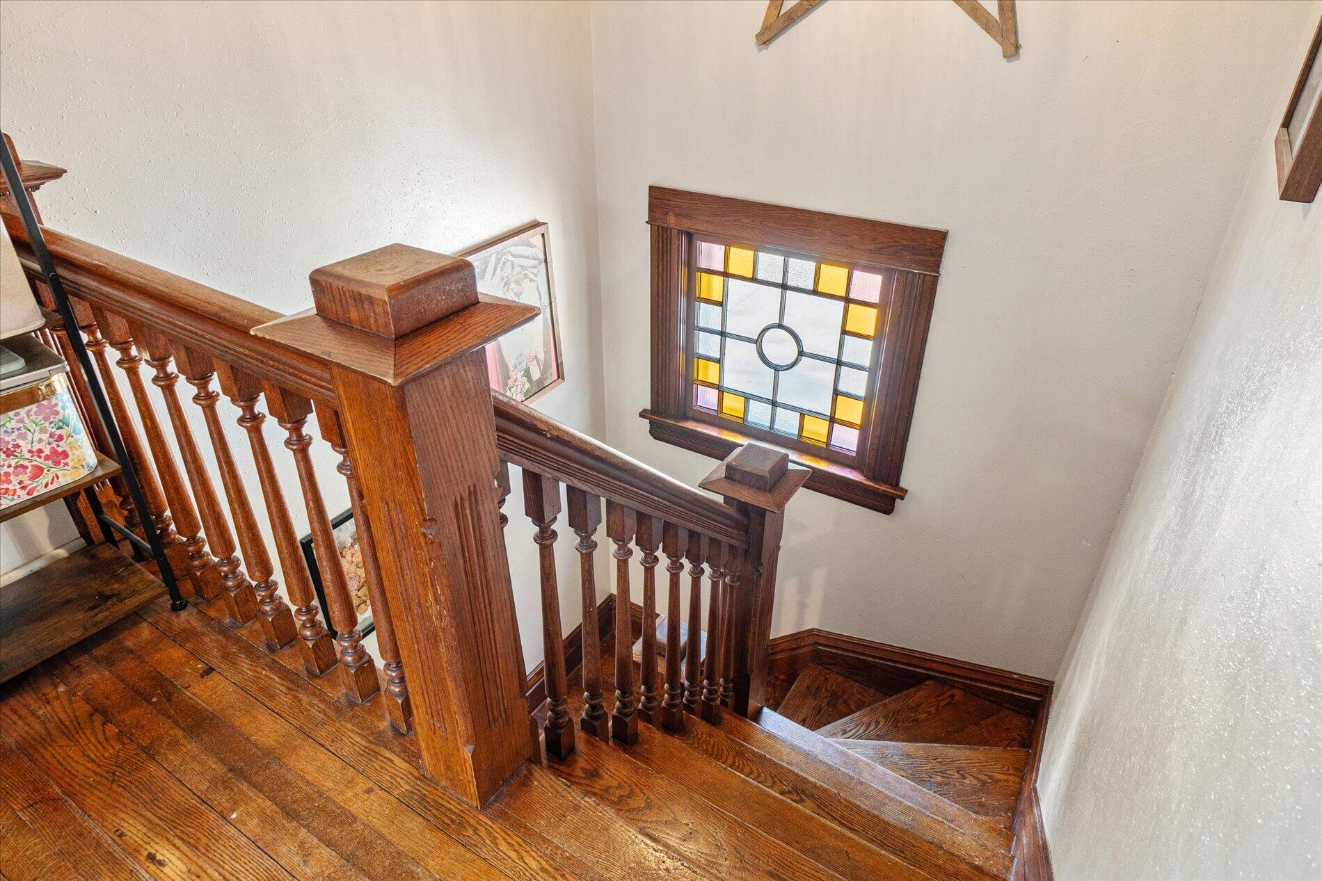211 Ramsland Street Westby, WI 54667 - Photo 11 of 24 Original Stairs w/ Stained Glass Window