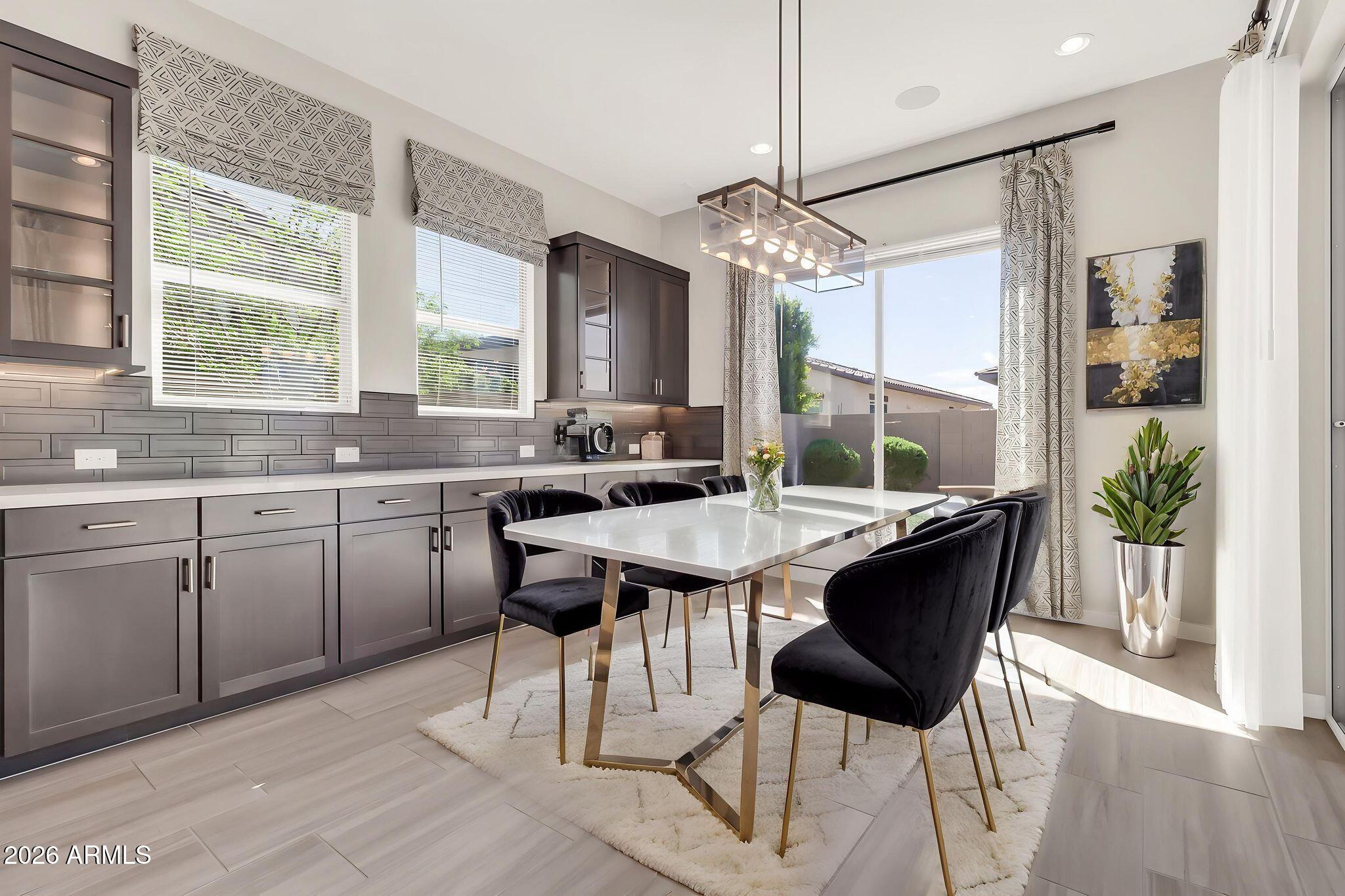 1441 East Powell Way Gilbert, AZ 85298 - Photo 21 of 63 a kitchen with a counter top space appliances and a large window