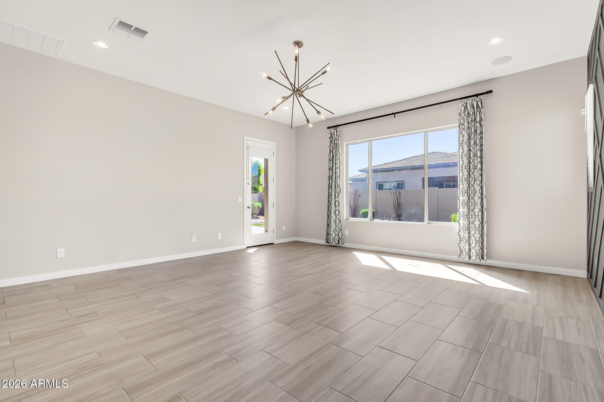 1441 East Powell Way Gilbert, AZ 85298 - Photo 24 of 63 a view of an empty room with a window