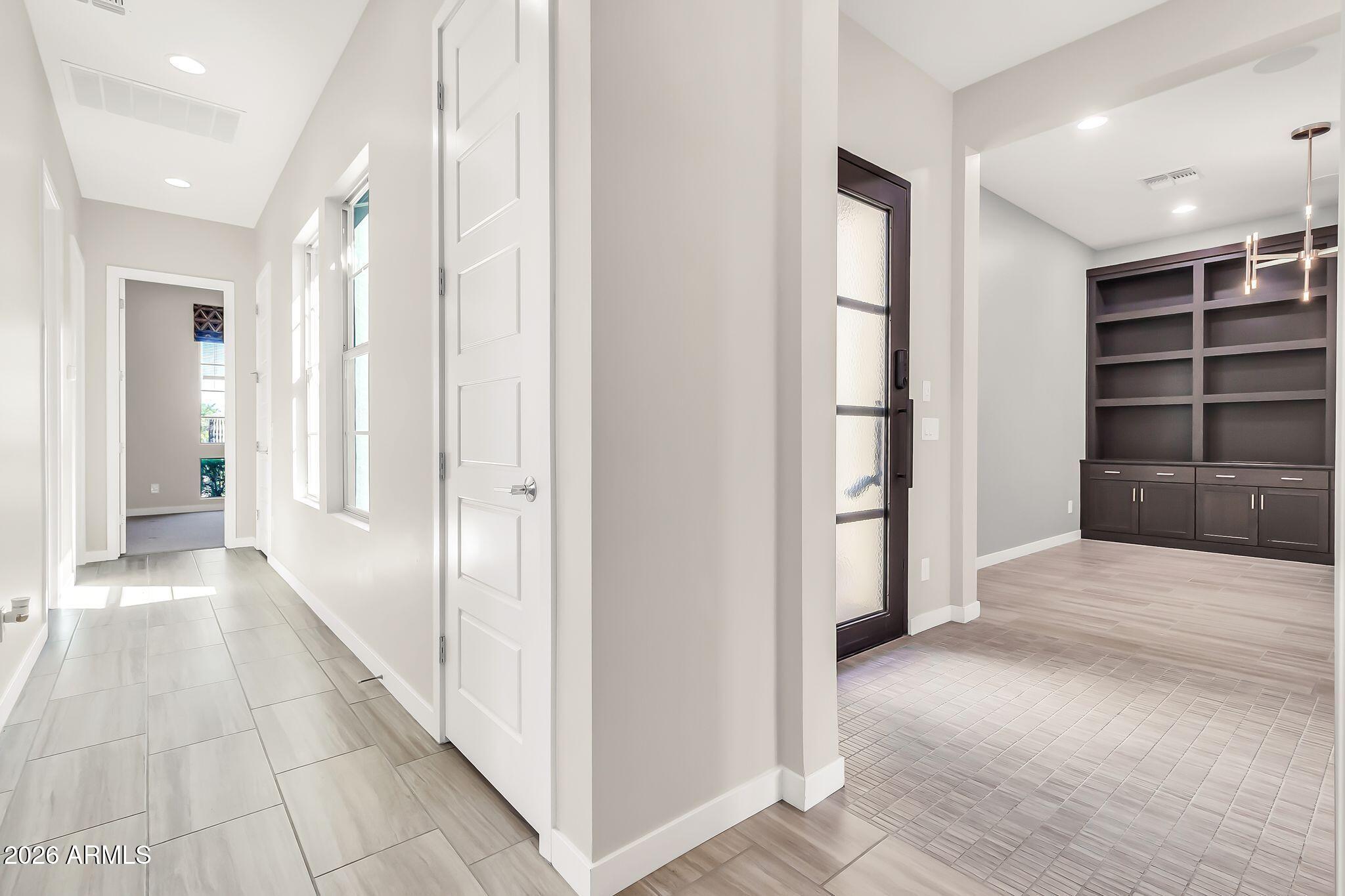 1441 East Powell Way Gilbert, AZ 85298 - Photo 32 of 63 a view of hallway with wooden floor and closet