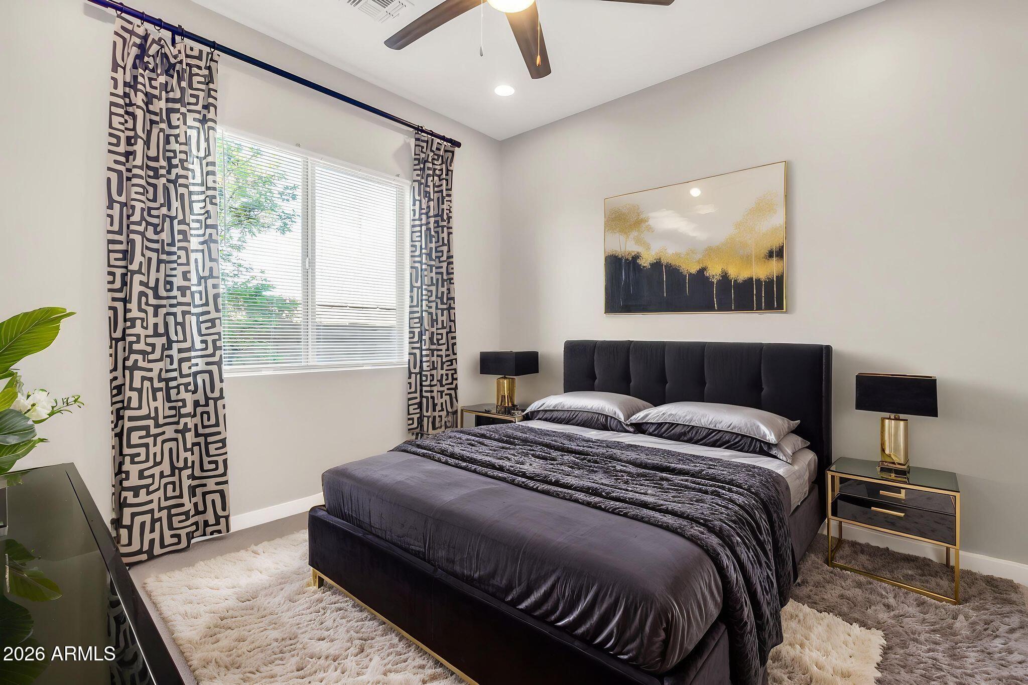 1441 East Powell Way Gilbert, AZ 85298 - Photo 35 of 63 a bedroom with a bed and wooden floor