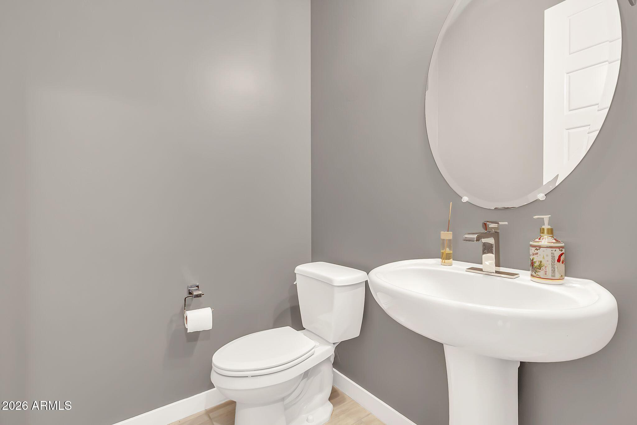 1441 East Powell Way Gilbert, AZ 85298 - Photo 42 of 63 a bathroom with a sink and a toilet