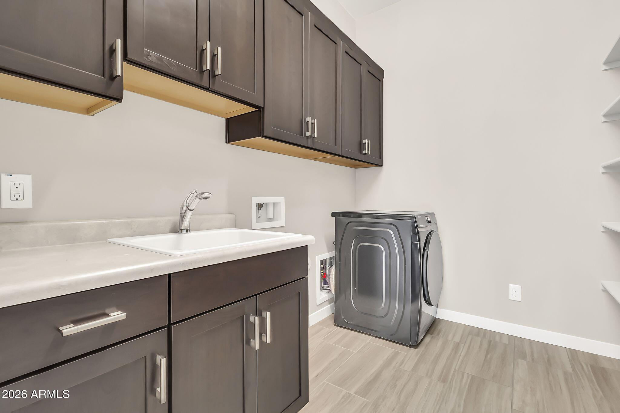 1441 East Powell Way Gilbert, AZ 85298 - Photo 43 of 63 a utility room with sink dryer and washer