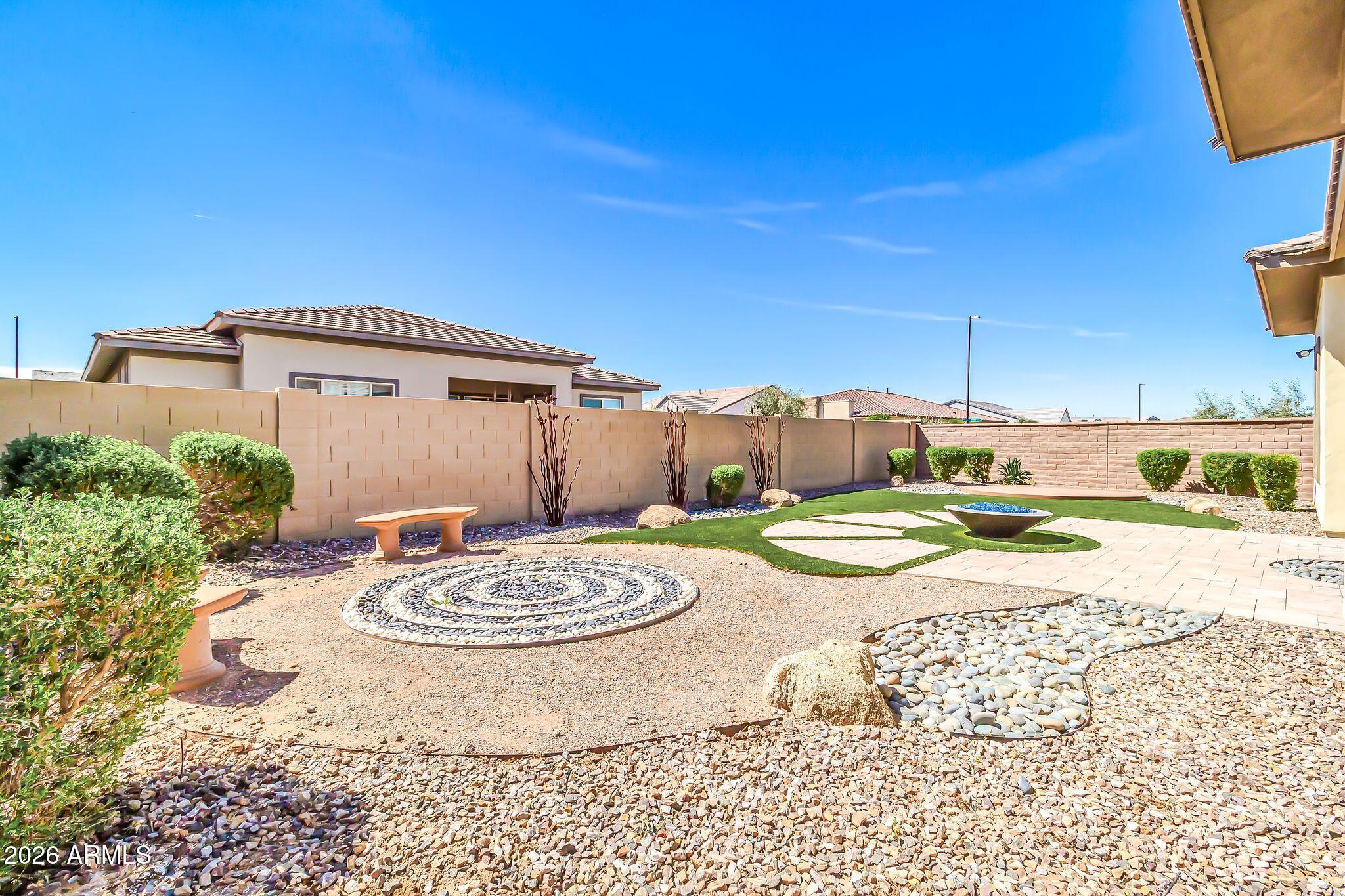 1441 East Powell Way Gilbert, AZ 85298 - Photo 50 of 63 a view of a chairs and table in backyard