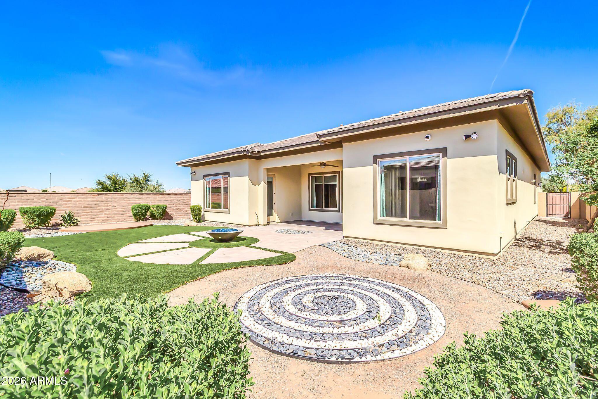 1441 East Powell Way Gilbert, AZ 85298 - Photo 51 of 63 a view of a house with backyard and sitting area