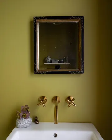 a bathroom with a sink and mirror