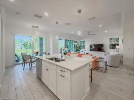 a room with lots of table and chairs