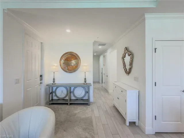 a view of a livingroom with furniture and mirror