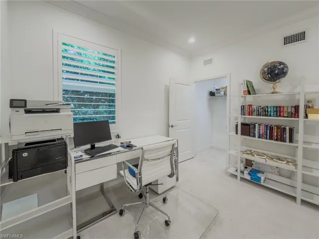 a view of a workspace with furniture