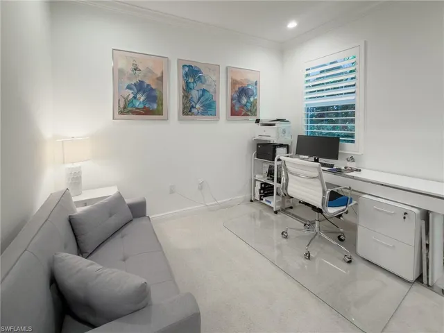 a workspace with furniture and a window