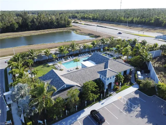 an aerial view of a house with a lake view