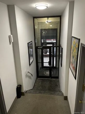 a bathroom with a sink a shower and a mirror