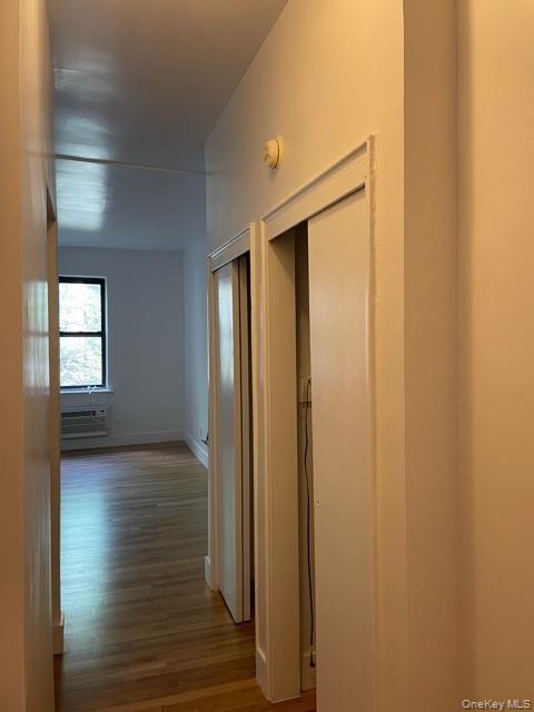 413 East 82nd Street, Unit 3A Manhattan, NY 10028 - Photo 5 of 10 a view of hallway with window and wooden floor
