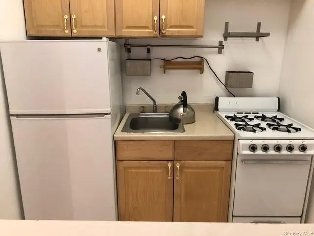 a kitchen with a stove and a microwave