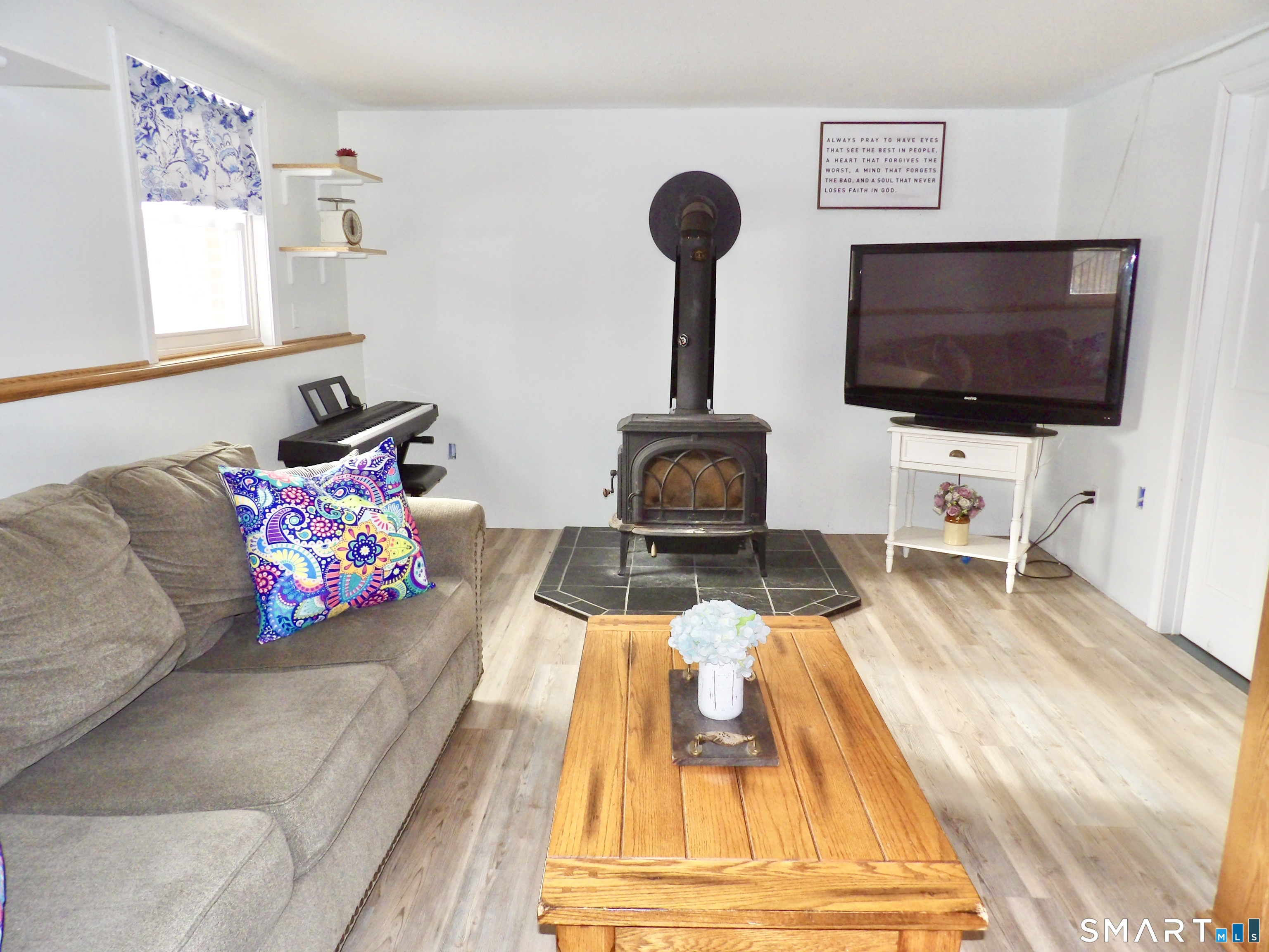 991 Shewville Road Ledyard, CT 06339 - Photo 23 of 29 Lower Level Family Room with a Wood stove.