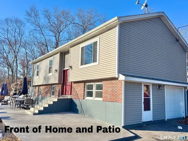 a backyard of a house with seating space