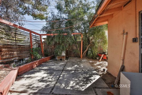 242 Peg Street Ridgecrest, CA 93555 - Photo 28 of 32 a view of a backyard with sitting area
