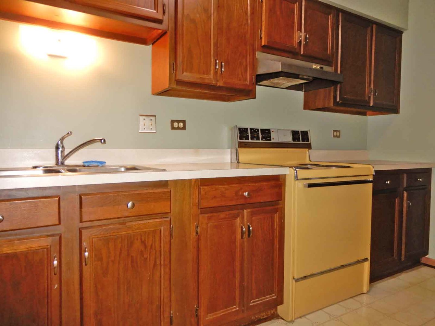 705 West Central Road, Unit 2C1 Mount Prospect, IL 60056 - Photo 7 of 8 a kitchen with a sink cabinets stainless steel appliances and cabinets