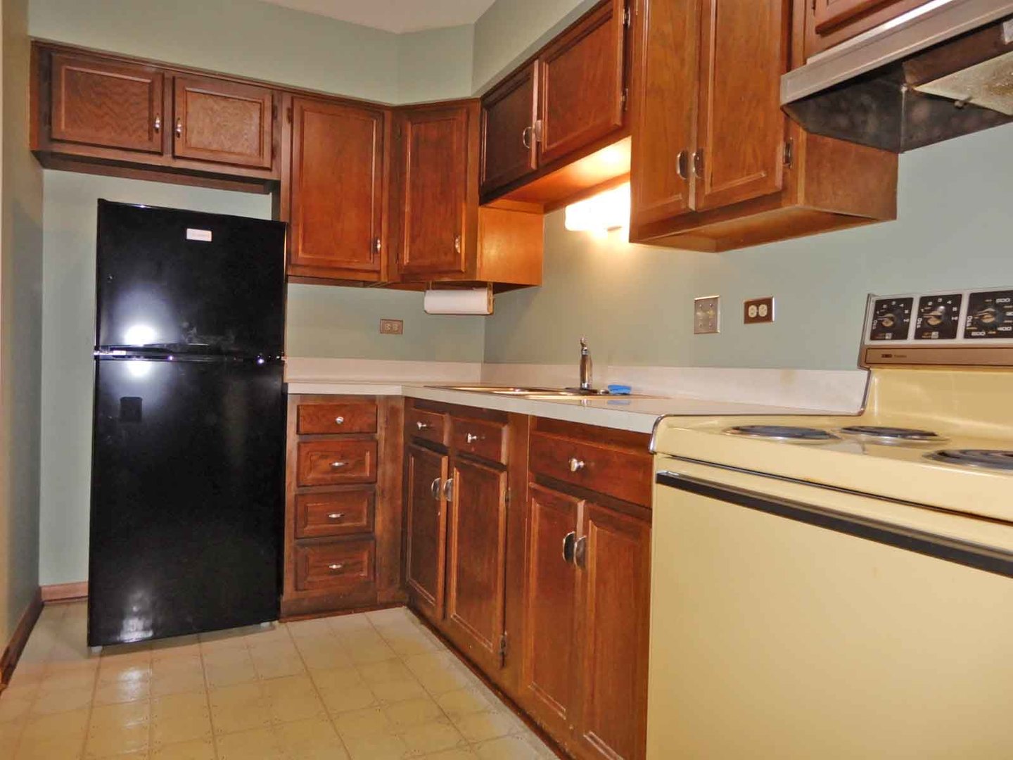 705 West Central Road, Unit 2C1 Mount Prospect, IL 60056 - Photo 8 of 8 a kitchen with stainless steel appliances granite countertop a refrigerator and a sink