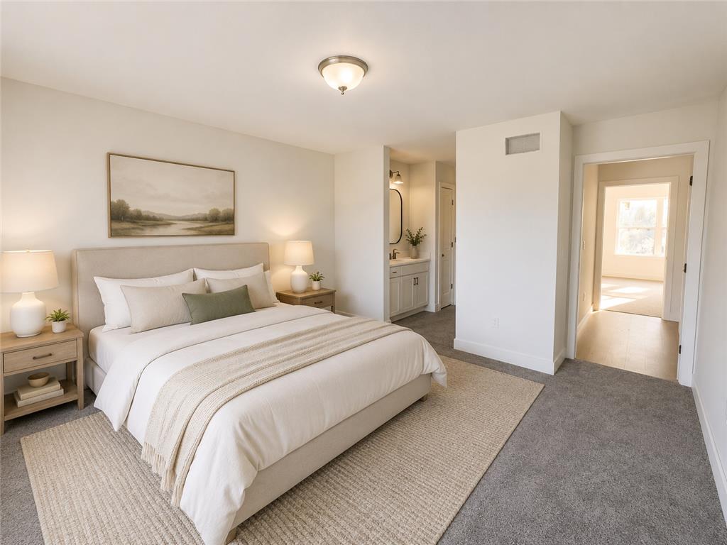 3104 Moyer Road Hellertown, PA 18055 - Photo 13 of 30 Plush carpeting and an adjacent vanity highlight this serene primary suite.