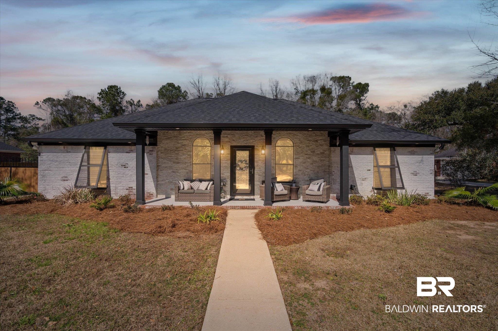 3216 Bay Booster Club Road Theodore, AL 36582 - Photo 1 of 46 View of front facade featuring a front yard, a porch, brick siding, and a shingled roof