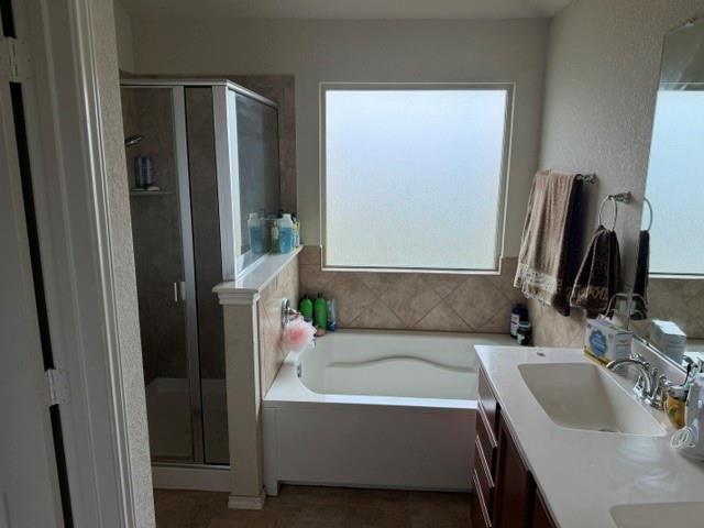5412 Tama Drive Waco, TX 76708 - Photo 22 of 24 a bathroom with a tub sink and mirror