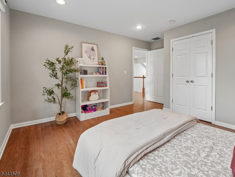 610 River Road Chatham, NJ 07928 - Photo 21 of 42 a bedroom with a bed and a wooden floor