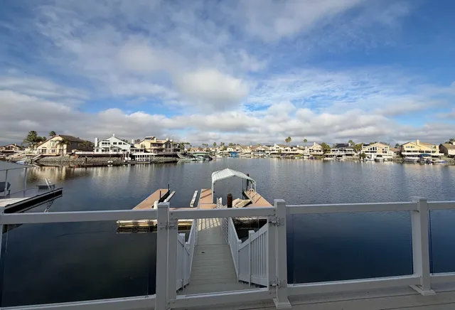 a lake view with a bench next to a lake