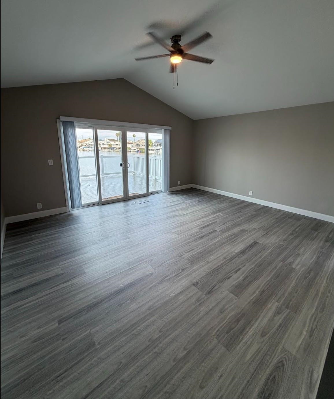 1958 Windward Point Discovery Bay, CA 94505 - Photo 9 of 12 a view of an empty room with wooden floor and a window